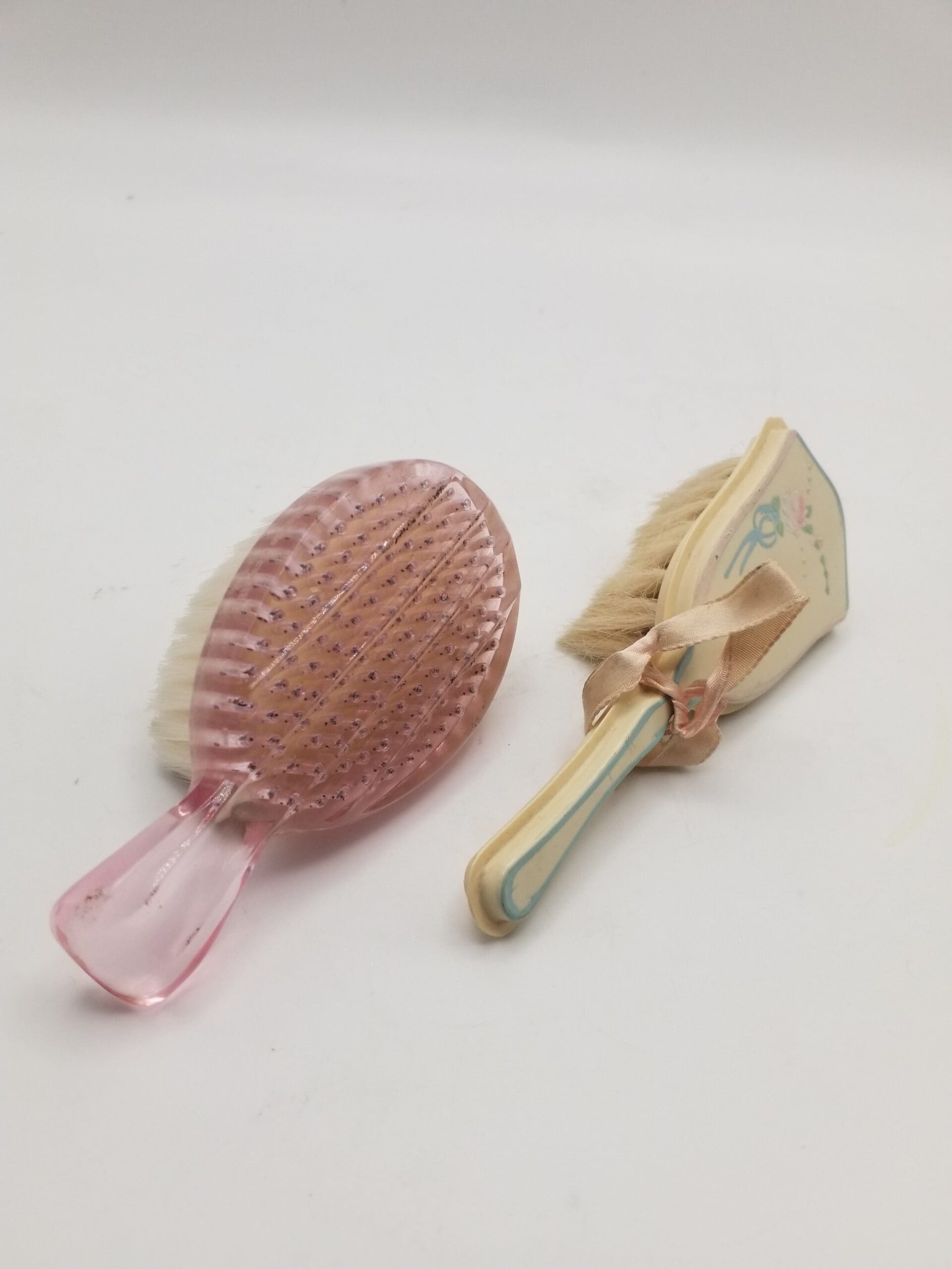 Pair of Vintage Baby Brushes, Translucent Pink & Yellow Celluloid with Satin Ribbon and Hand-Painted Design - As-Is