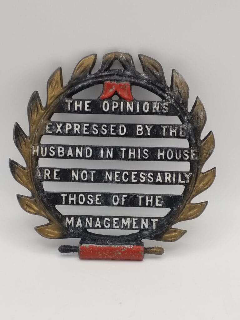 Vintage Novelty 1950s Trivet Painted Cast Iron "The opinions expressed by the husband..."